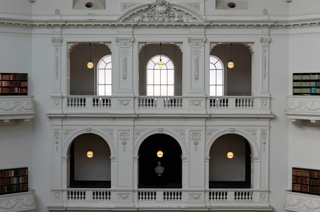 Bright library interior with arched windows