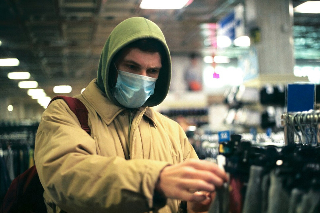 store detective watching customers